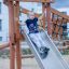 Child sliding down the Etna playground slide.