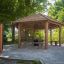 Wooden outdoor pavilion Firehouse in a natural, green park setting.
