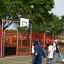 Children playing basketball on the Shea playground.