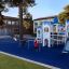 Children playing on Aztec arch steel structure playground equipment.