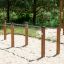 Double gymnastic bar on a sandy outdoor playground.