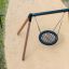 Bird Nest (âŚ€ 90 cm) Wooden Swing hanging on wooden frame in playground