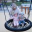 Bird Nest (Ø 90 cm) Wooden Swing with children sitting and adult supervising at playground