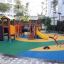 Children's playground featuring the Alpha playhouse with slide.