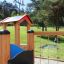 Alpha playhouse with slide in a sunny park