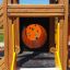 Alpha playhouse with slide wooden structure with colorful panels and tunnel entrance