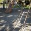 Climbing net structure for children at a playground.