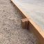 Larch Board Section Low bordering a playground area'