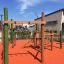 Spillikins wooden playhouse in an outdoor playground.