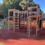 Wooden Climbing Booth Nature playhouse in a playground.