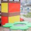 a clover shaped play table on the playground