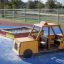 a colourful sandpit and a taxi play house