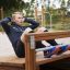 Man performing sit-ups on a Sit-ups Bench in an outdoor fitness park.