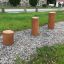 Stumps (3 pcs.) on gravel path in outdoor setting
