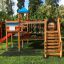 Queen Jubilee playhouse with slide, wooden playground set with bridge and ladders.