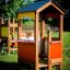 Wooden Playhouse for kids in a garden setting.
