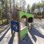 Gas Station playground structure in a wooded park setting