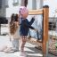 Children drawing on Blackboard outdoor play equipment.
