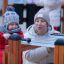 Child and adult playing on outdoor Xylophone playground equipment.