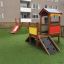 Playhouse with slide and climbing wall on playground