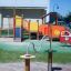 Playground equipment Rings with colorful elements and slides in the background.