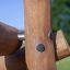 Close-up view of Kalahari wooden playhouse structure with bolts.