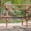 Sonora wooden playhouse playground equipment in a natural setting