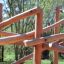Sonora wooden playhouse in a natural outdoor setting.