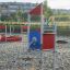 Neptune Single Playhouse at playground with sandy surface