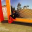 Modern outdoor bench Ribbon Fitness I in a park setting.