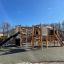 Outdoor play structure Challenger Nature II with a slide in a park.