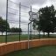 Outdoor basketball hoop on the Multiarena Wooden court by the lake.