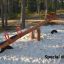 Wooden seesaw with red handles for 4 children