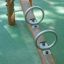 the stainless steel handles of the robinia playground seesaw