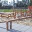 wooden seesaw for 4 children on the playground