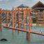 Robinia Double Seesaw (4 seats) wooden playground equipment on safety surface