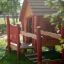 wooden and red playhouse for playgrounds