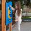 Child playing with Bingo Board educational outdoor toy.