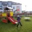 Country House playhouse with slide in backyard playground