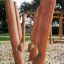 Trim Trail Nature III wooden playground equipment for outdoor activities.