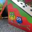 Colorful Tent wooden playhouse with owl decorations on the side panel.