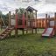 an outdoor playground set with a tower and a slide