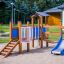 a playground tower with a slide in the nursery