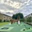 Square trampoline (100 cm) on a modern playground in a residential area.