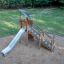 Elbrus wooden playground slide with metal chute in outdoor park setting
