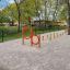Outdoor obstacle course with Agility Mini Jump Bars and orange rings.