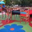 Colorful playground structure on Wetpour 45 surface with slides and tunnels.