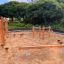 Outdoor obstacle course for kids in a sandy playground.