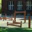 Trim trail outdoor wooden playground equipment for balance and climbing activities.