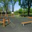 Trim trail outdoor fitness trail with wooden climbing and balancing equipment in park